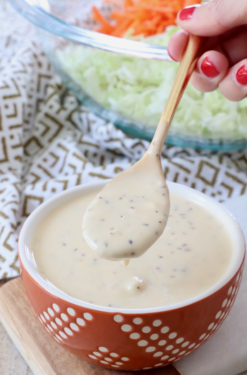 coleslaw dressing in small bowl and spoon