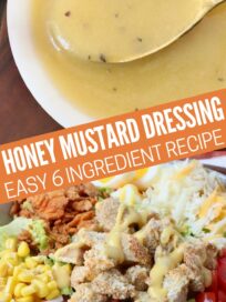 honey mustard dressing in bowl with spoon and drizzled over salad in a bowl