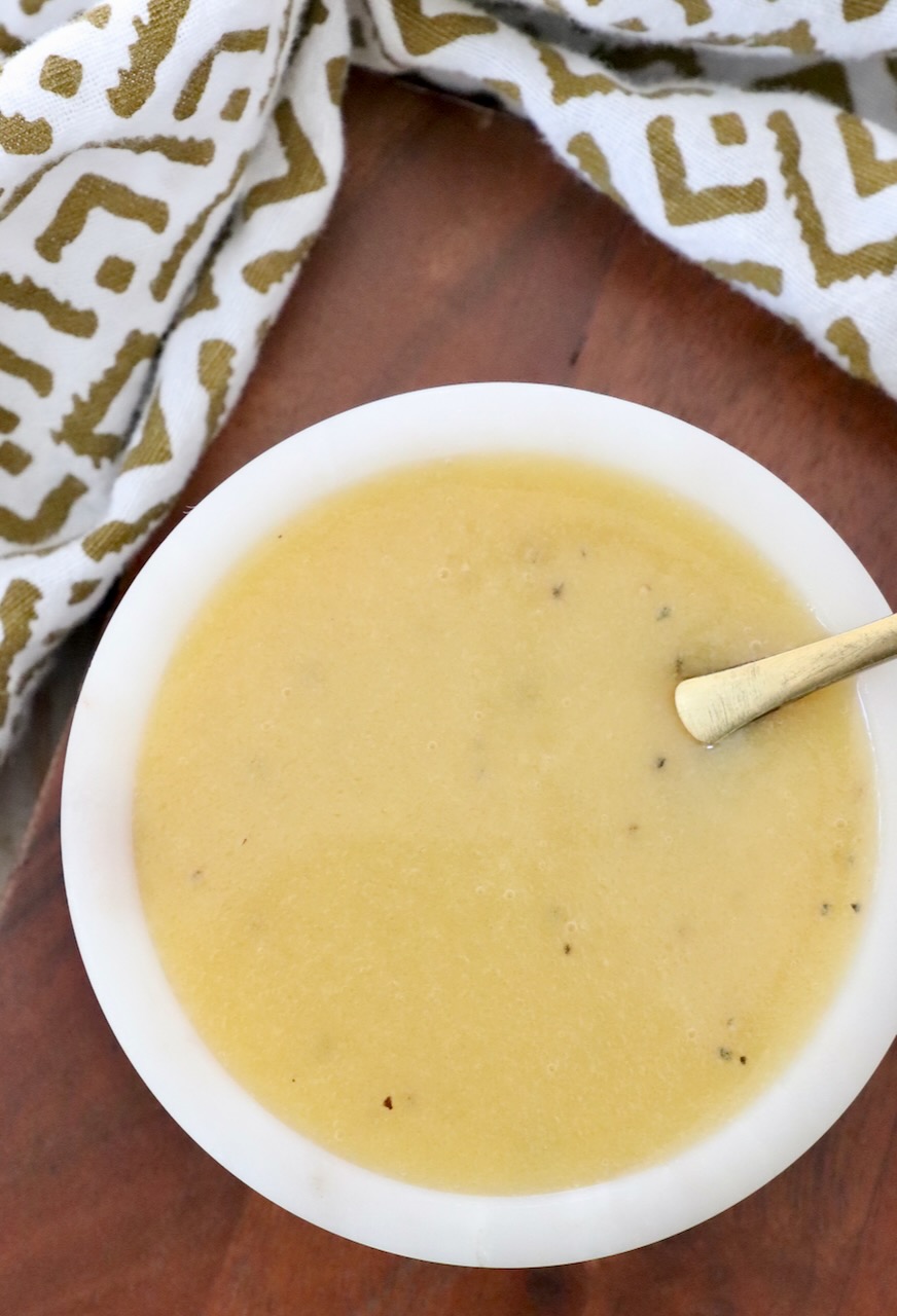 honey mustard dressing in small bowl with spoon