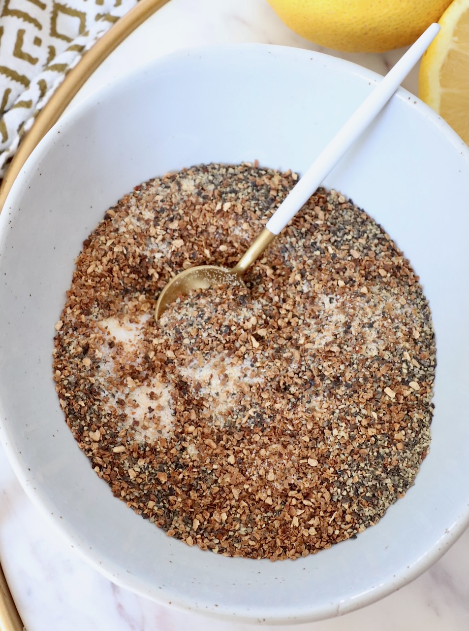 spices mixed together in bowl with small spoon