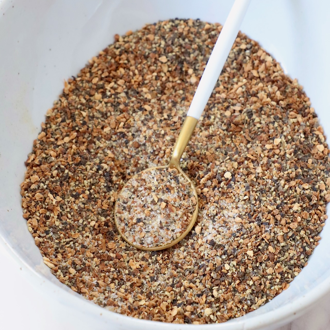 lemon pepper seasoning in bowl with spoon