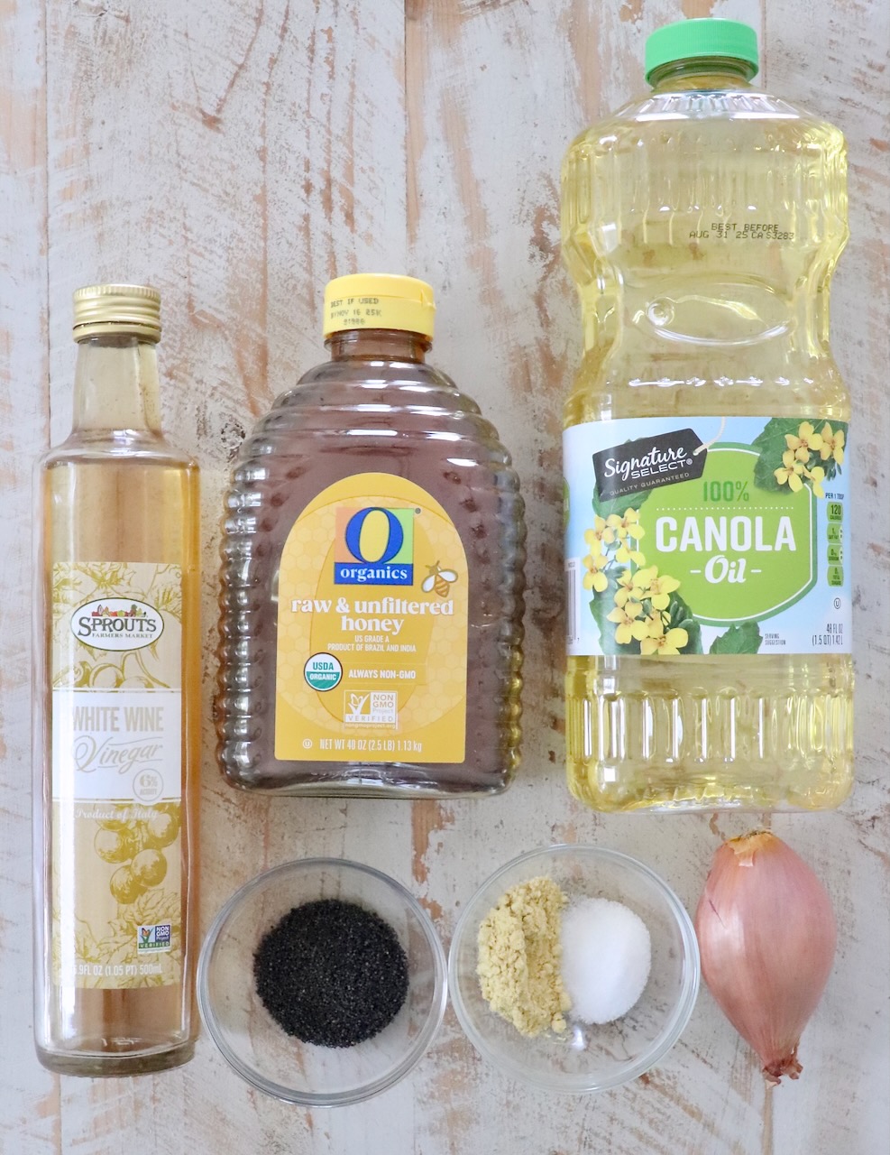ingredients for poppy seed dressing on white wood board