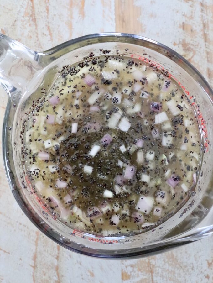 poppy seed dressing in glass mixing bowl