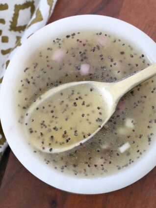 poppy seed dressing in small bowl with spoon