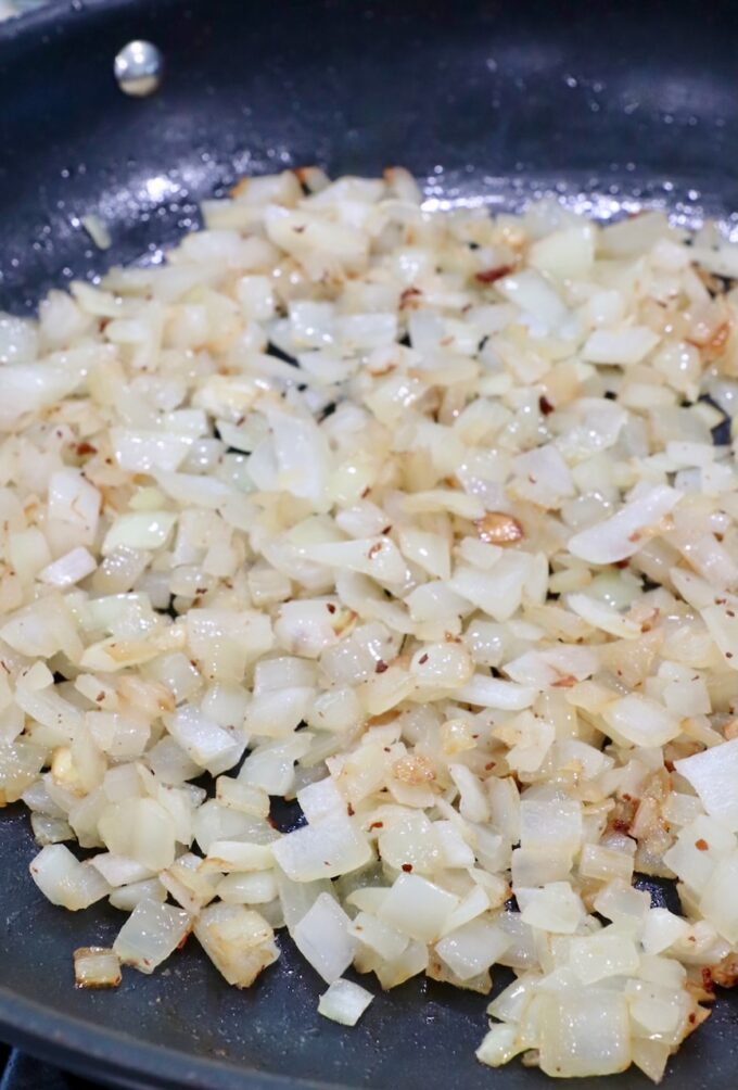 diced cooked onions in skillet