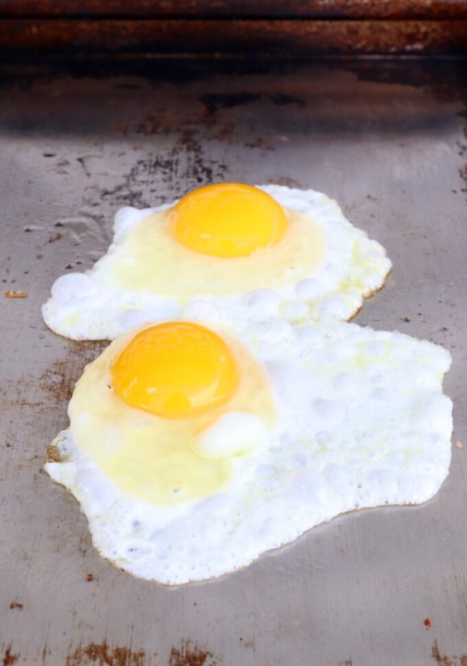 eggs frying on flat top