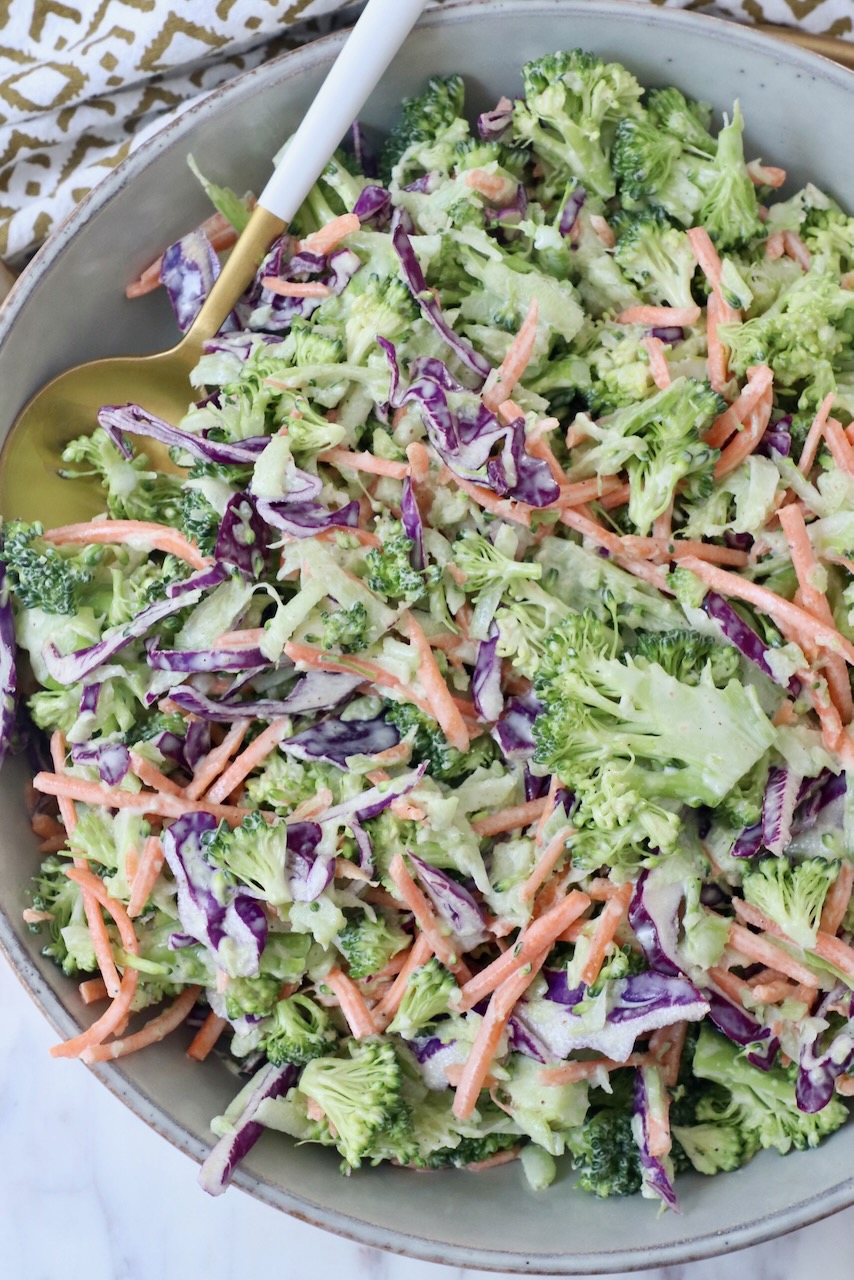 broccoli slaw in bowl with spoon