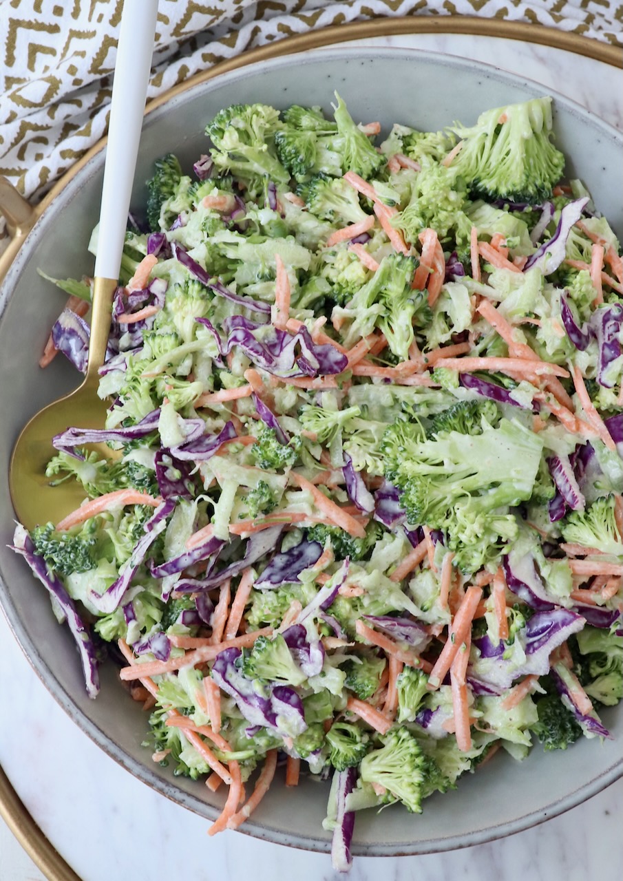 broccoli slaw in bowl with spoon