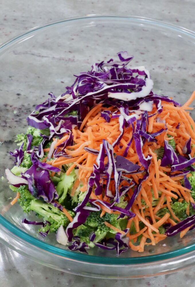 chopped broccoli, shredded carrots and shredded cabbage in bowl