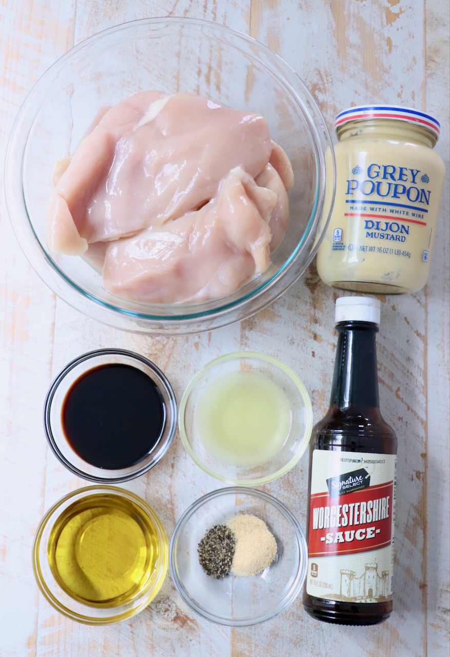 ingredients for chicken marinade on white wood board