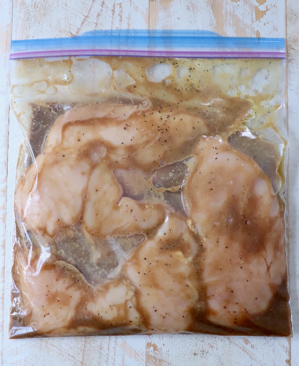 chicken breasts in plastic zipper bag with marinade
