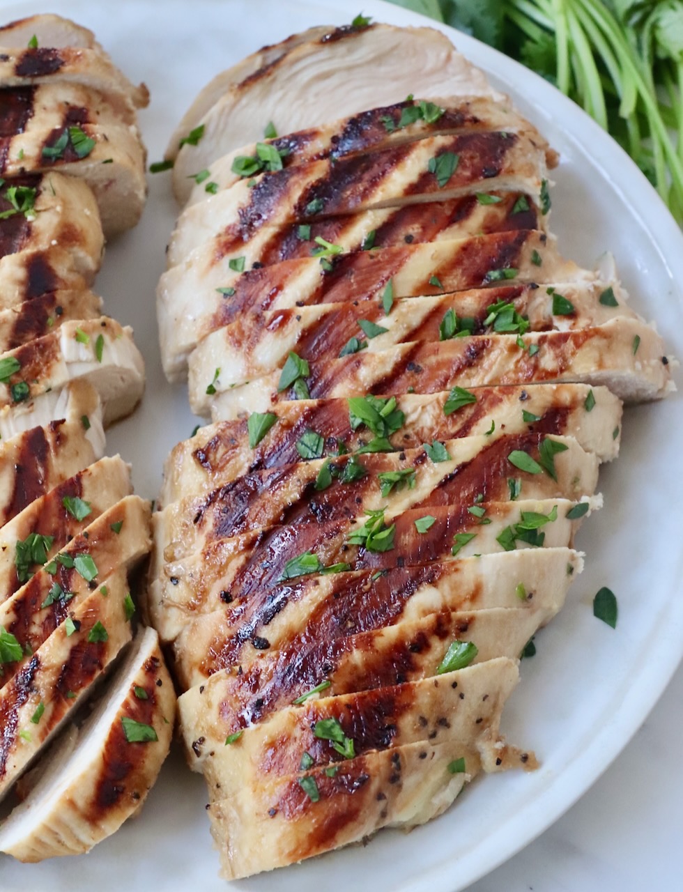sliced grilled chicken on plate