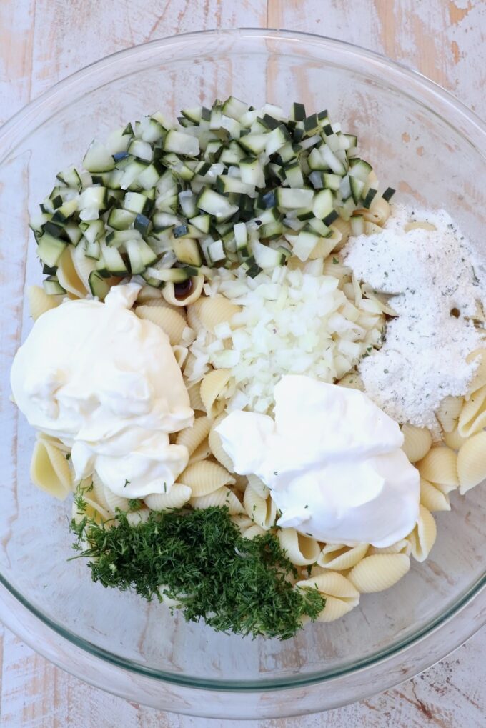 ingredients for pickle pasta salad separated in bowl