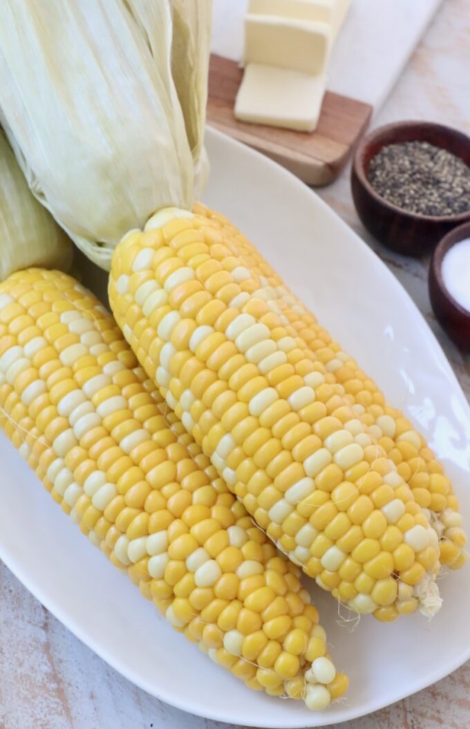 oven roasted corn on the cob on plate