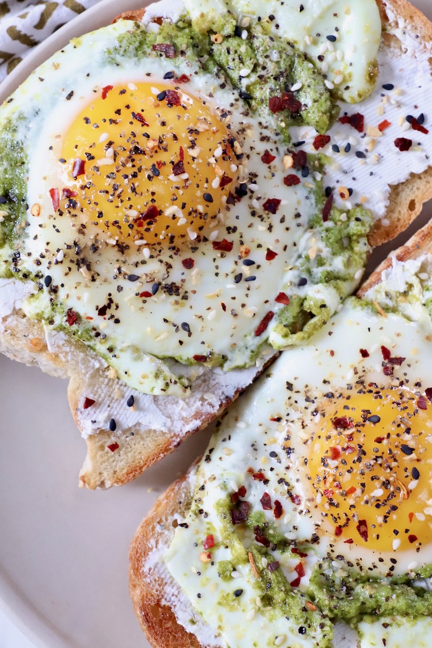 pesto eggs on toast on plate