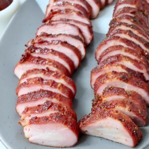 sliced pork tenderloin on plate