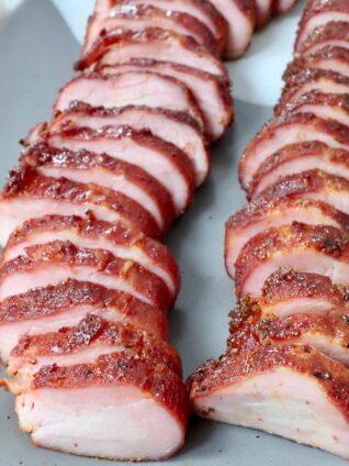sliced pork tenderloin on plate