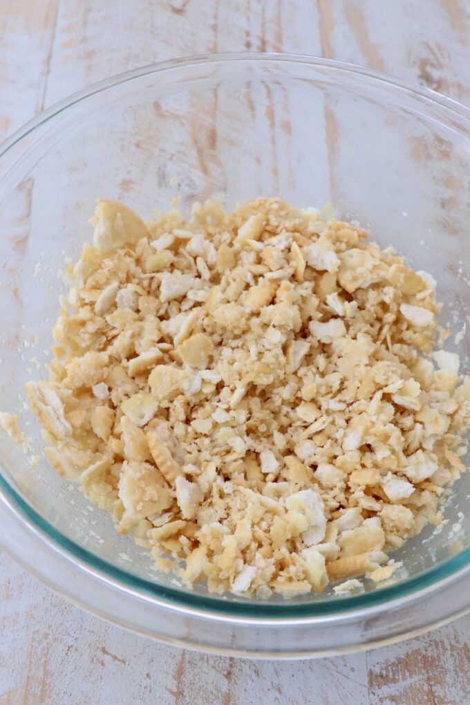 crumbled crackers combined with butter in a glass bowl