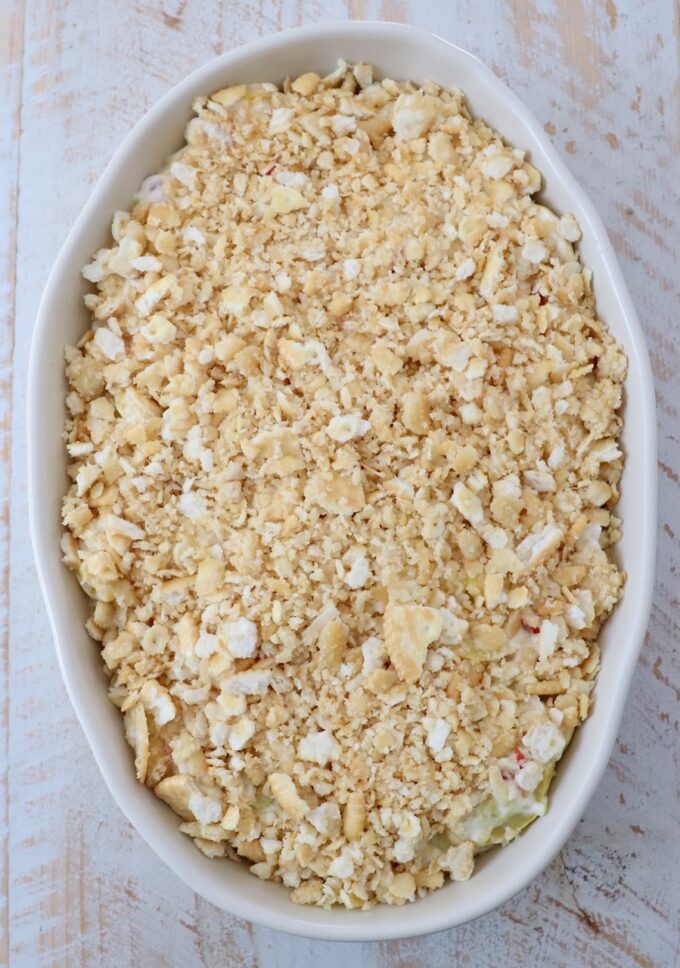 squash casserole with a cracker topping in a casserole dish