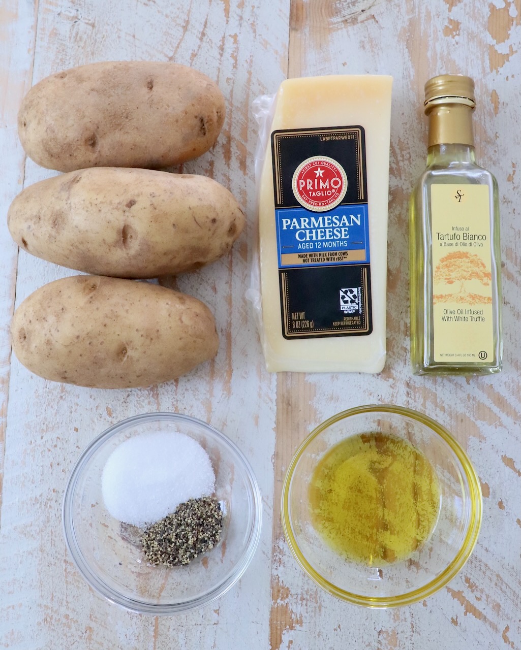 ingredients for truffle fries on white wood board