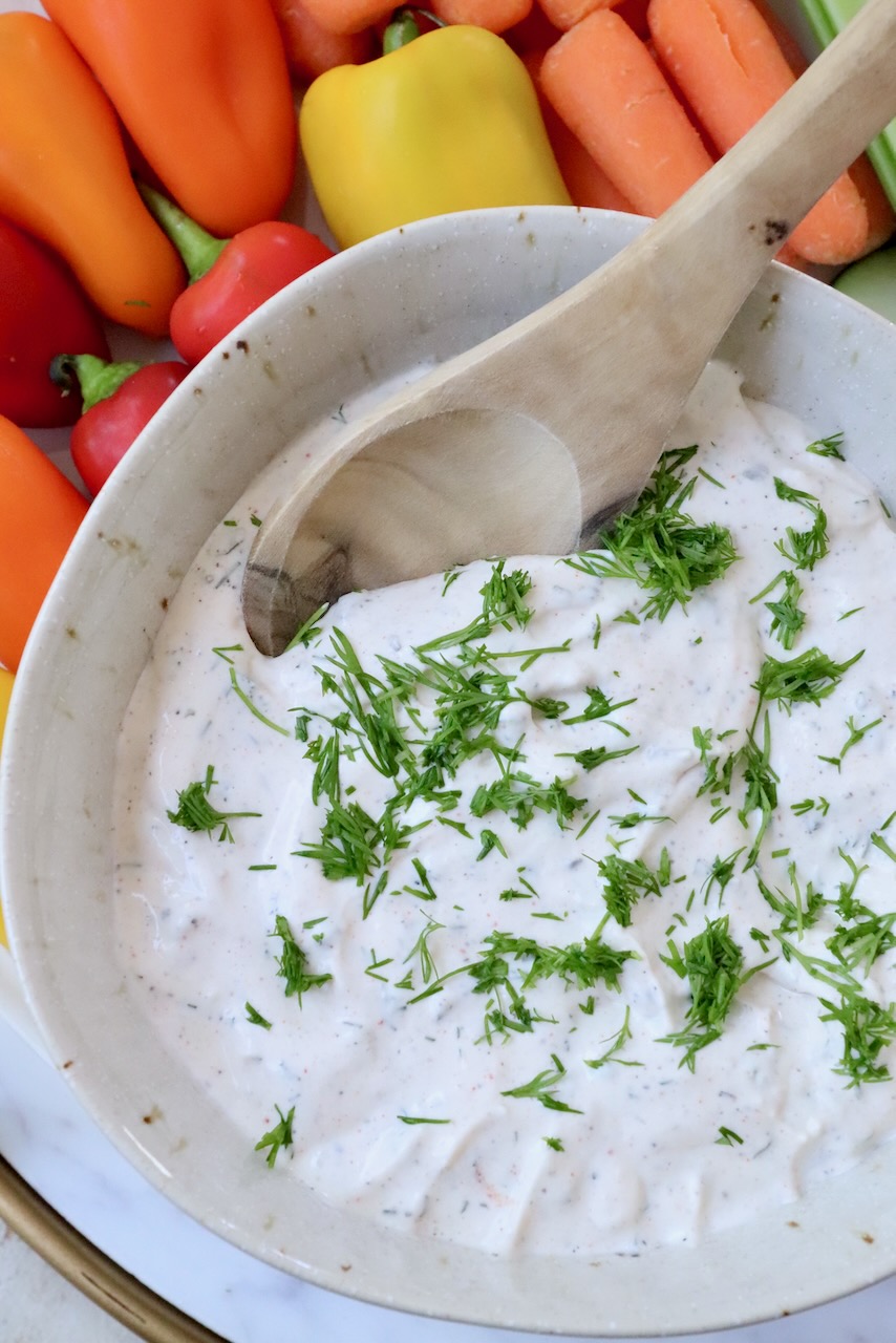 creamy dip in bowl topped with fresh chopped dill