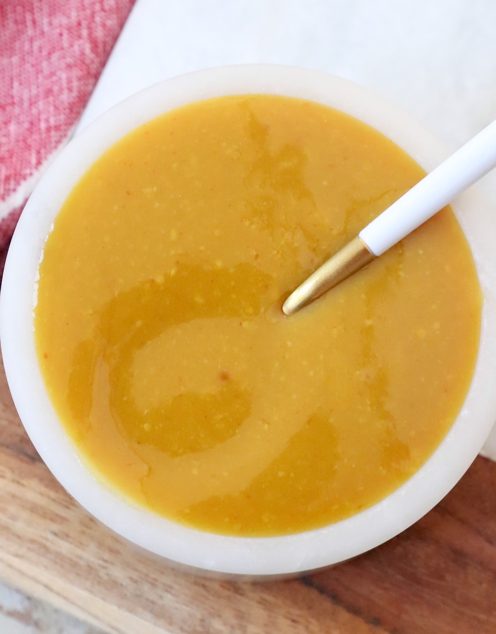 mustard bbq sauce in bowl with spoon