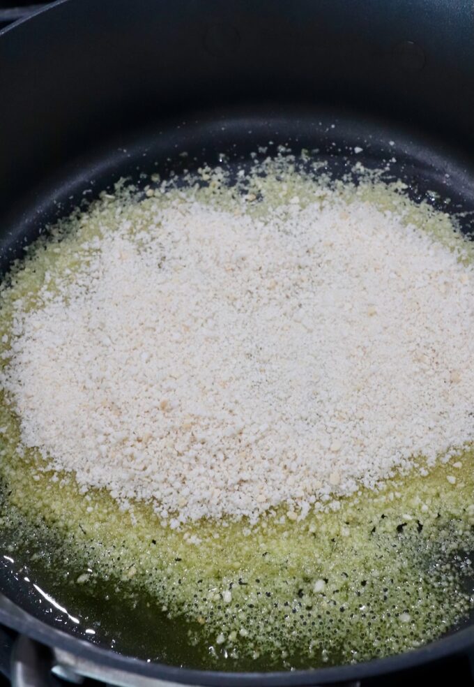 breadcrumbs with olive oil in skillet