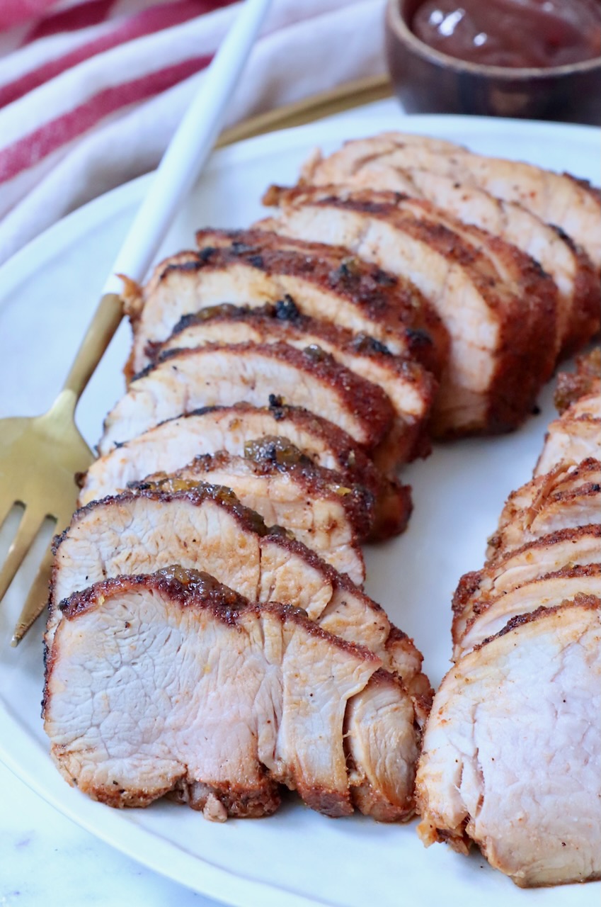 sliced grilled pork tenderloin on plate