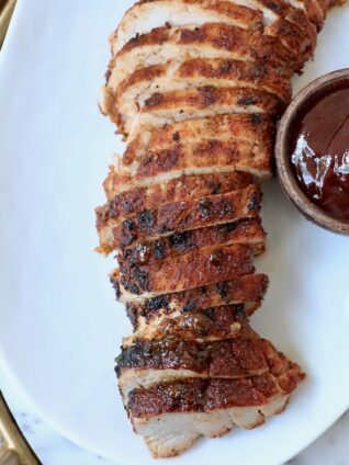 sliced grilled pork tenderloin on plate