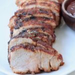 grilled pork tenderloin sliced on plate