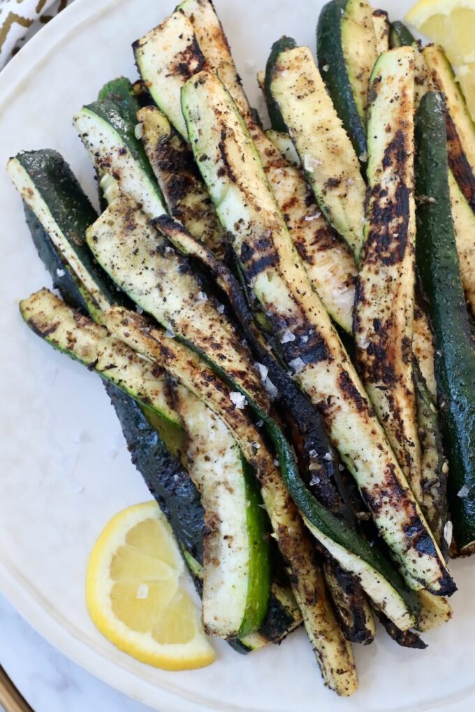 grilled zucchini spears on plate