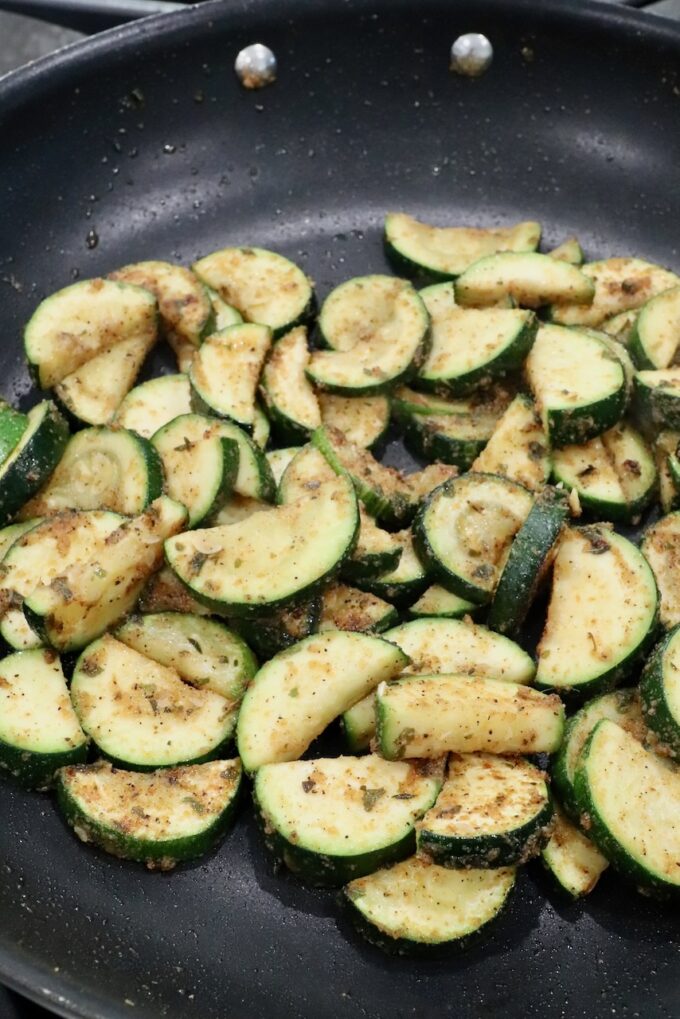 cooked slices of zucchini in skillet