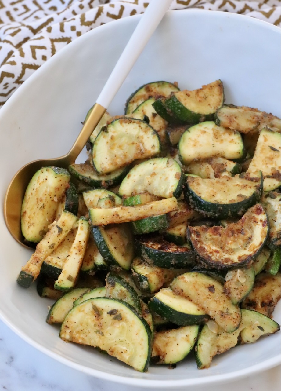 sauteed zucchini in bowl with spoon