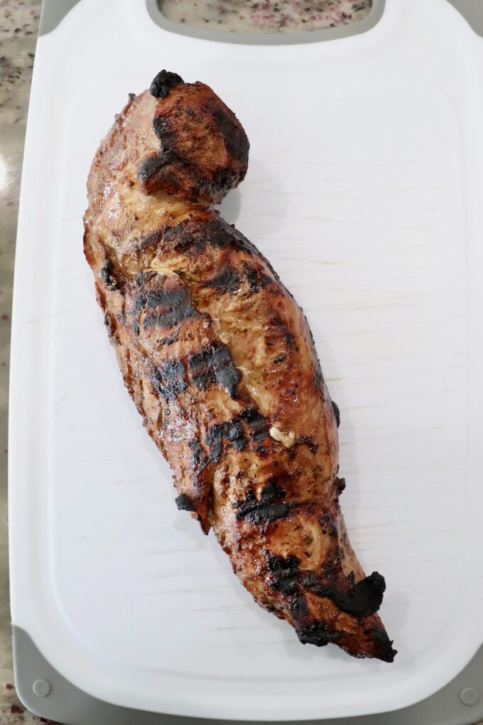 grilled pork tenderloin on cutting board