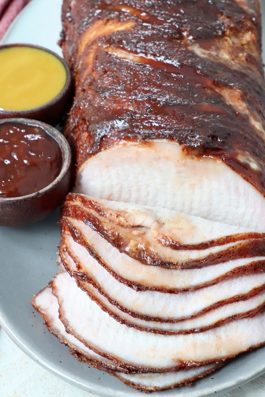 sliced smoked pork loin on serving platter