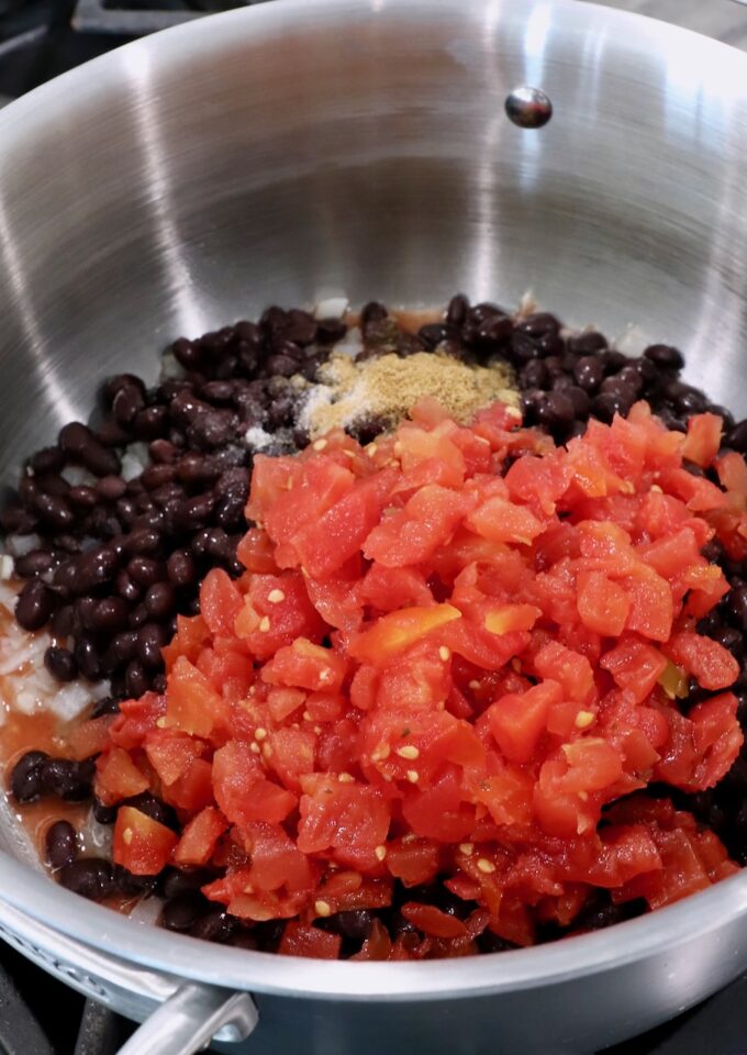 black beans in pot with diced tomatoes