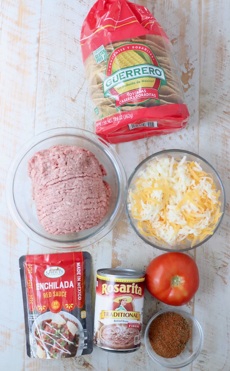 ingredients for Mexican pizza on white wood board