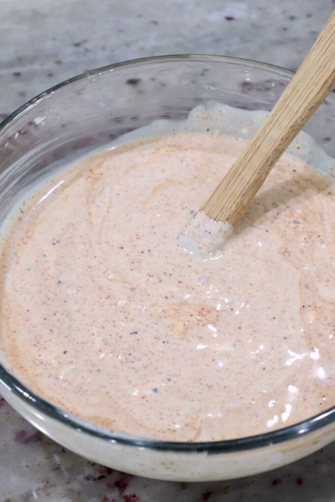 creamy chili lime dressing in glass bowl with spatula