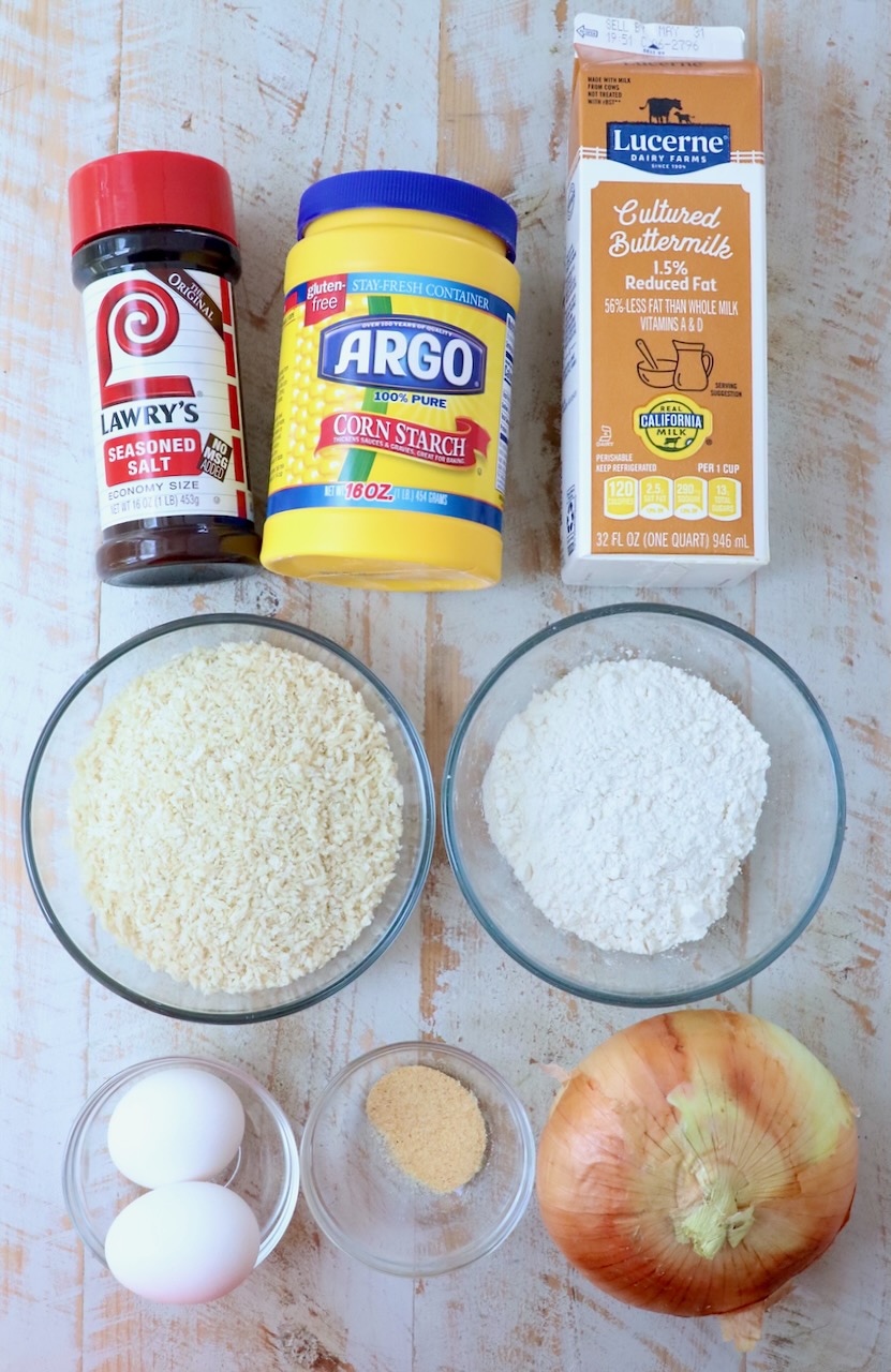 ingredients for onion rings on white wood board