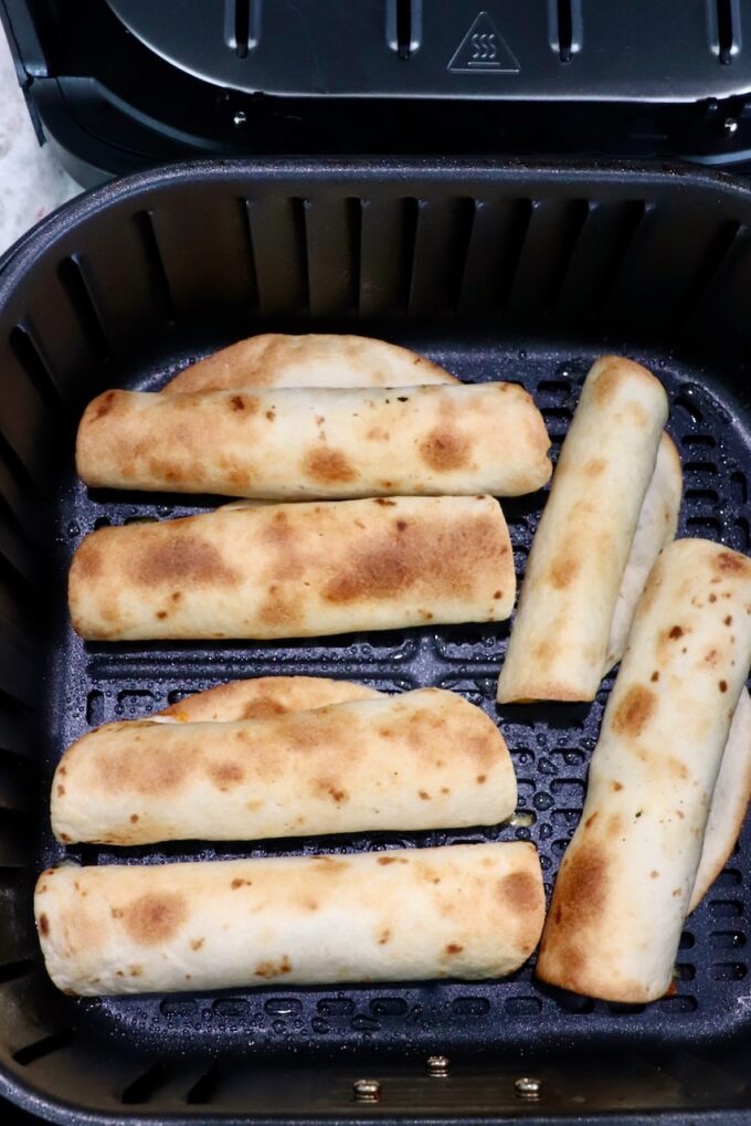 cooked taquitos in air fryer basket