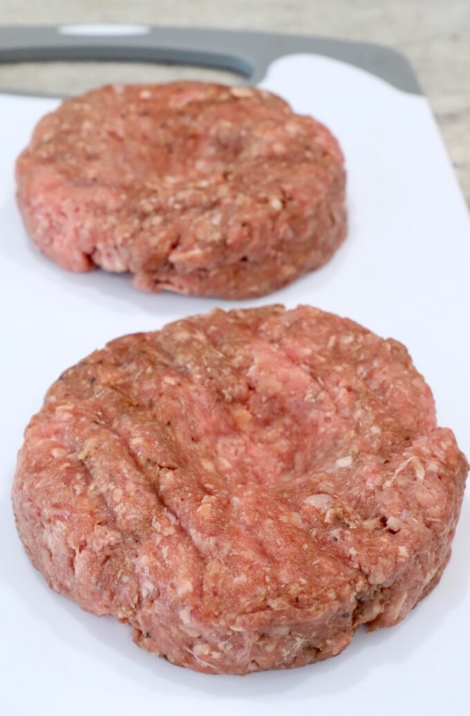 burger patties on cutting board