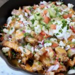 carne asada fries in cast iron skillet