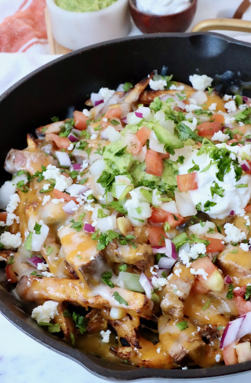 carne asada fries in cast iron skillet