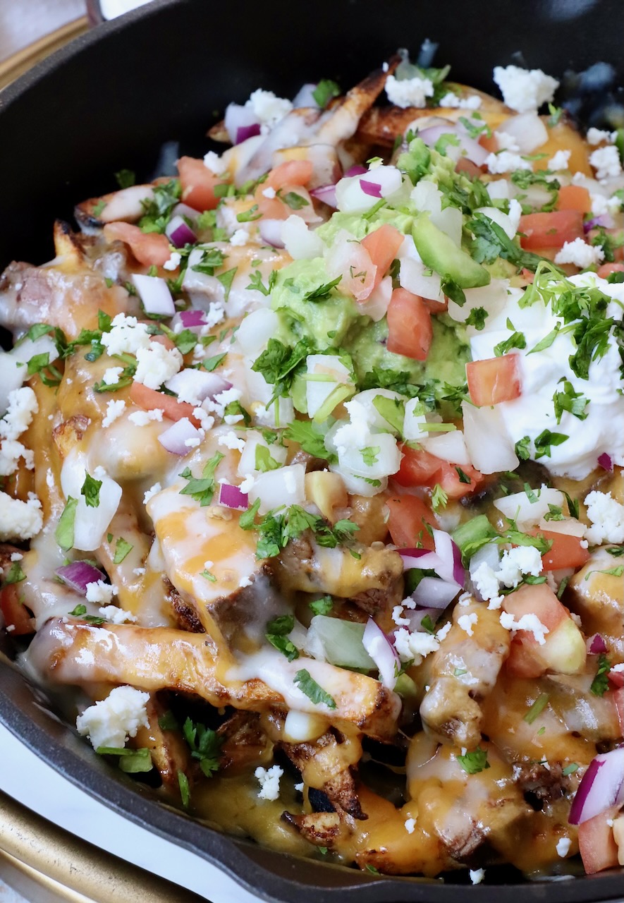 carne asada fries in cast iron skillet