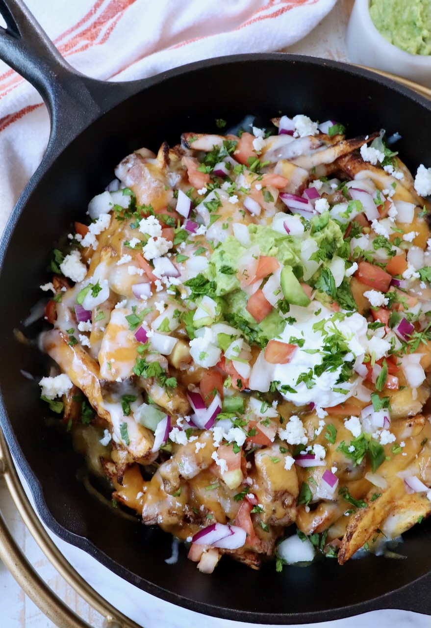 carne asada fries in cast iron skillet