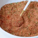 carne asada seasoning in bowl with spoon