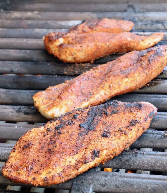 seasoned grilled chicken on a grill