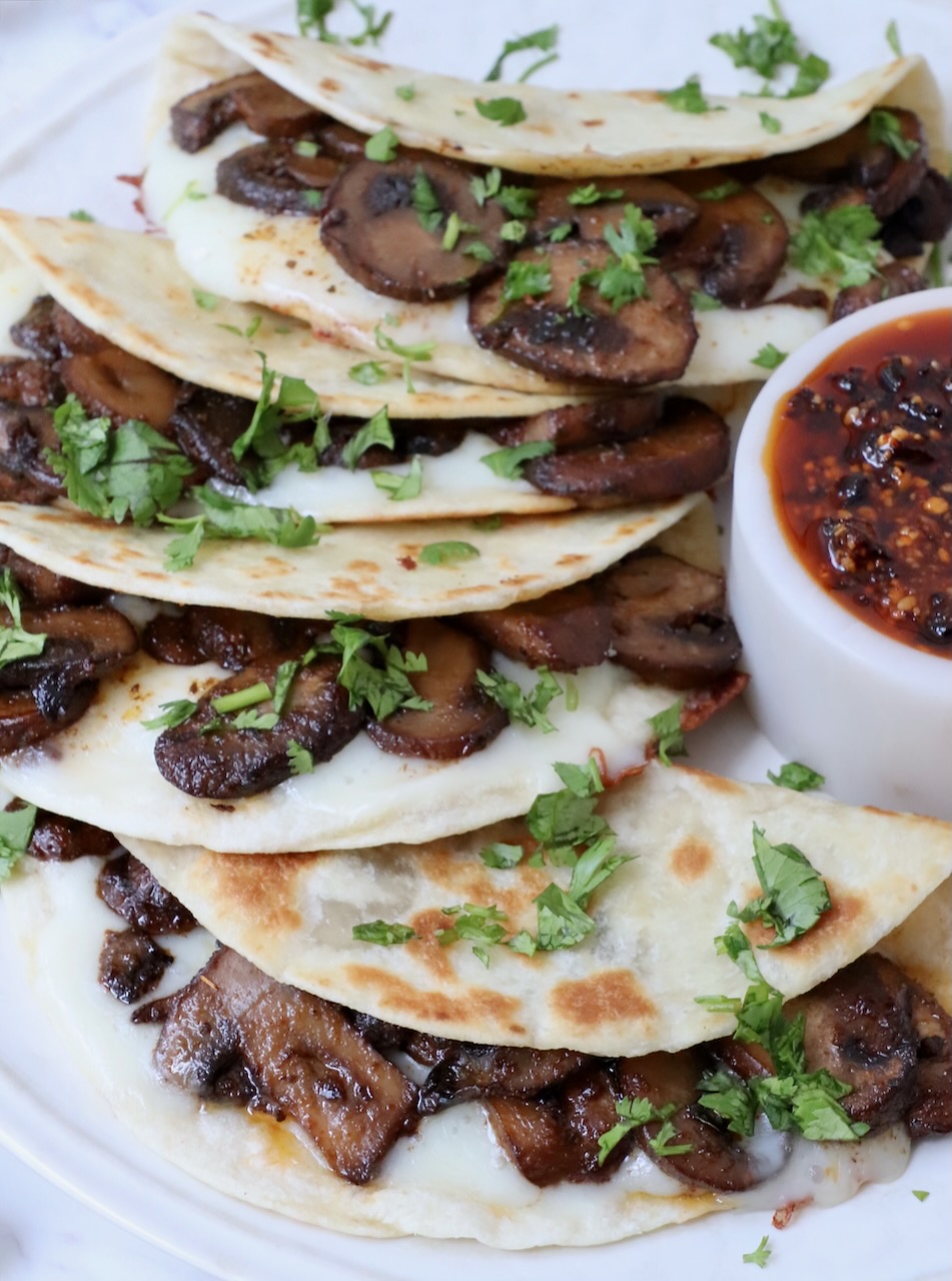 mushroom tacos stacked up on a plate