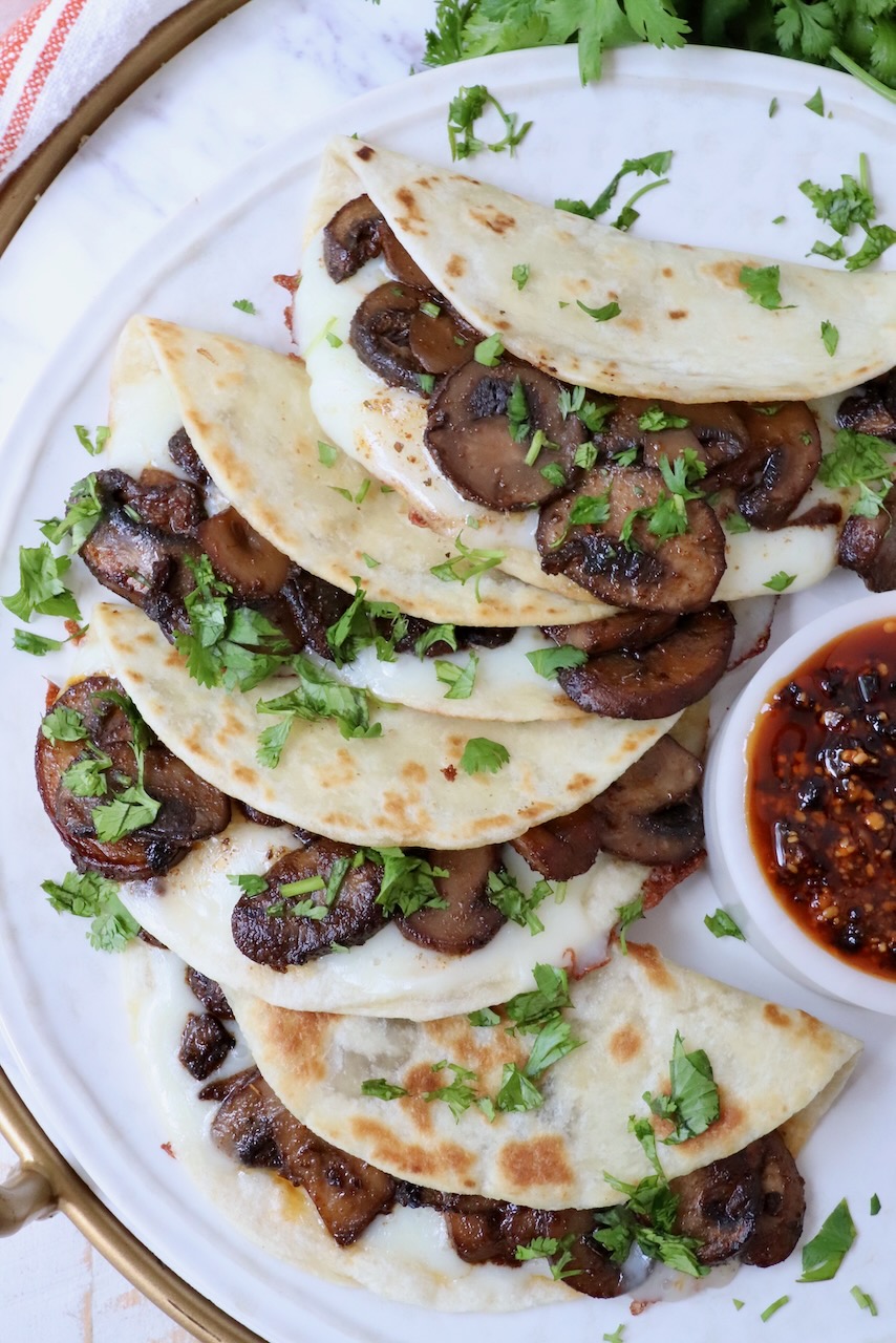 mushroom tacos stacked up on a plate