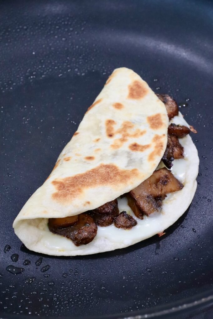 mushroom taco with cheese in a skillet